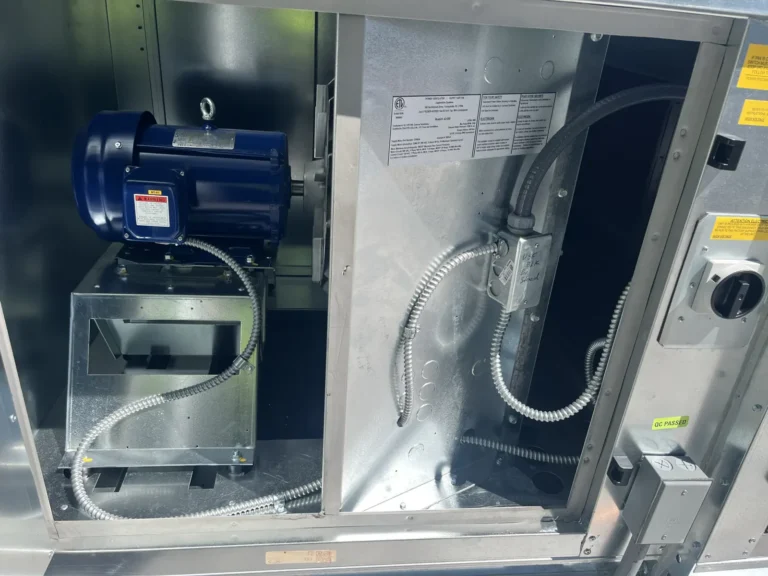 New blower motor installed in a commercial fan cabinet