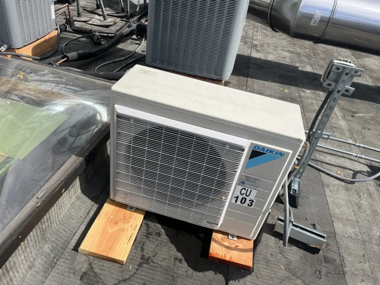 Ductless heat pump condenser set on a commercial roof in Seattle