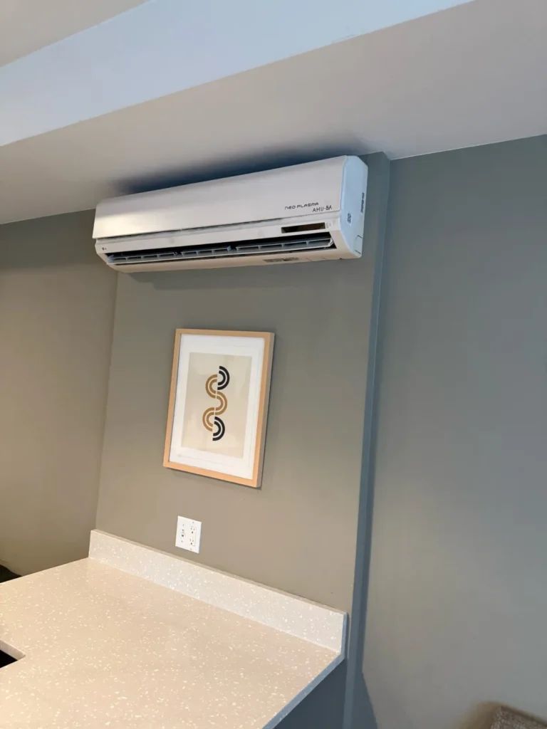 Ductless wall-mounted heat pump unit in a fitness room