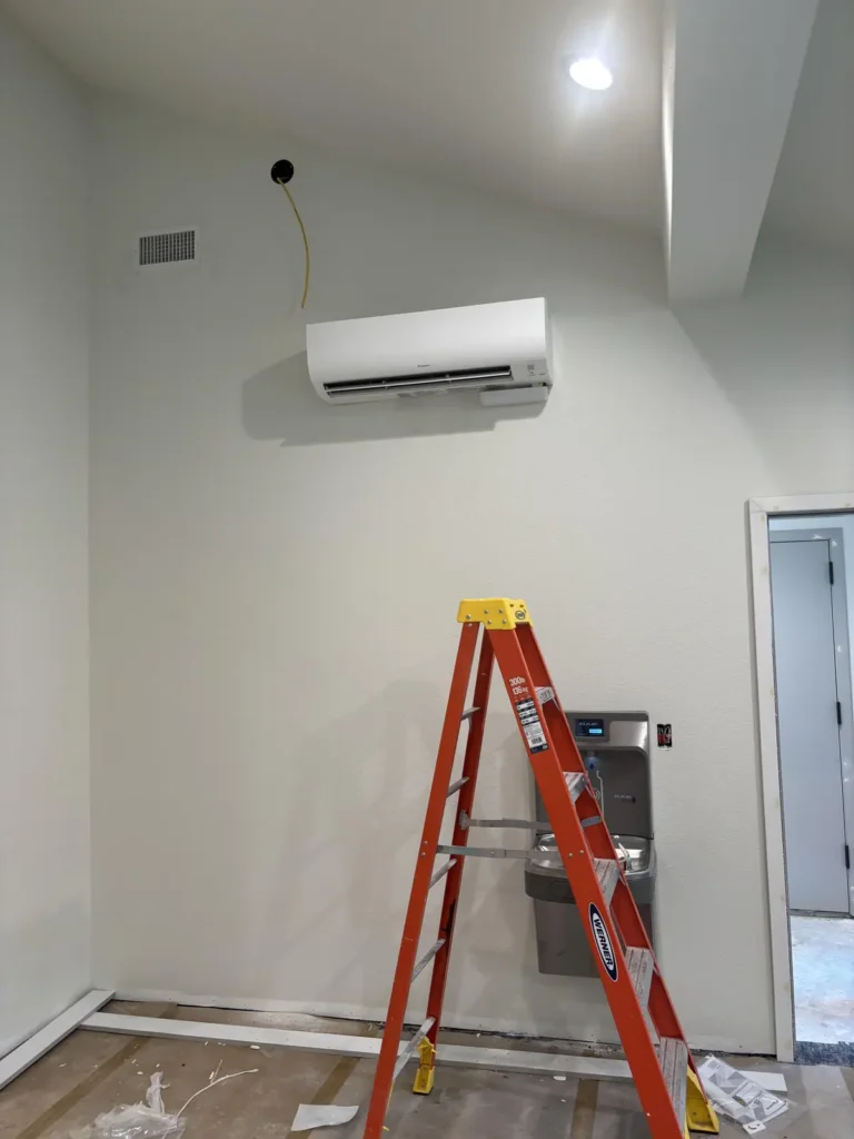Newly installed ductless wall unit in a community gym
