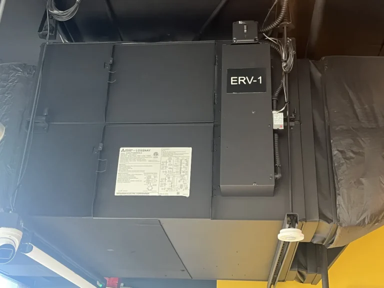 Ceiling-hung energy recovery ventilator (ERV) serving a commercial space