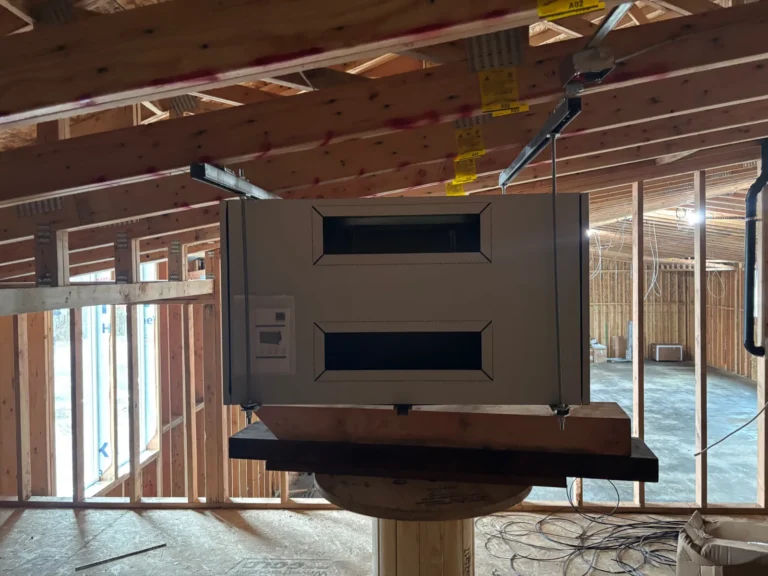 Energy recovery ventilator (ERV) being lifted into place at a church renovation
