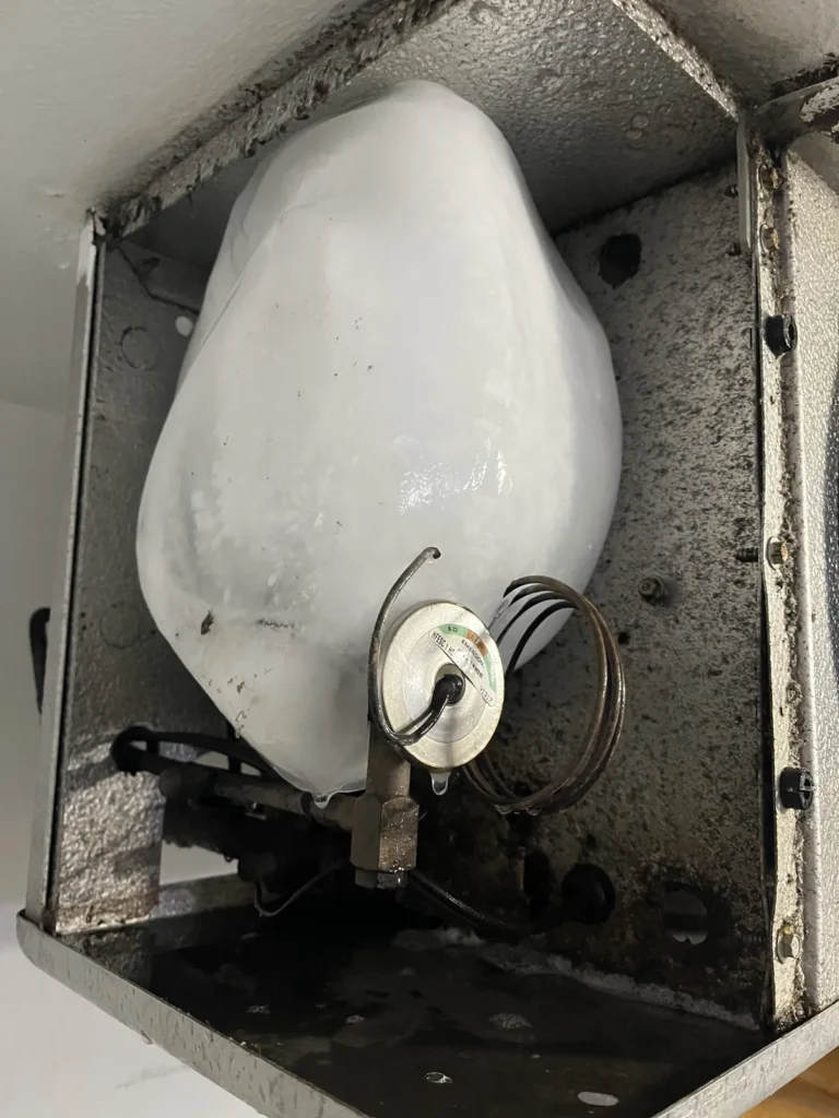 Iced-over evaporator coil found on a walk-in cooler service call