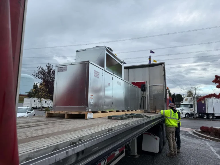 New rooftop unit arriving on a flatbed for a restaurant install in Federal Way