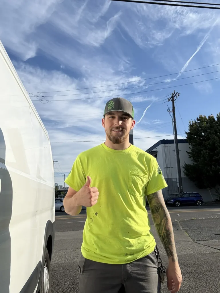 Omni Mechanical technician next to his service van