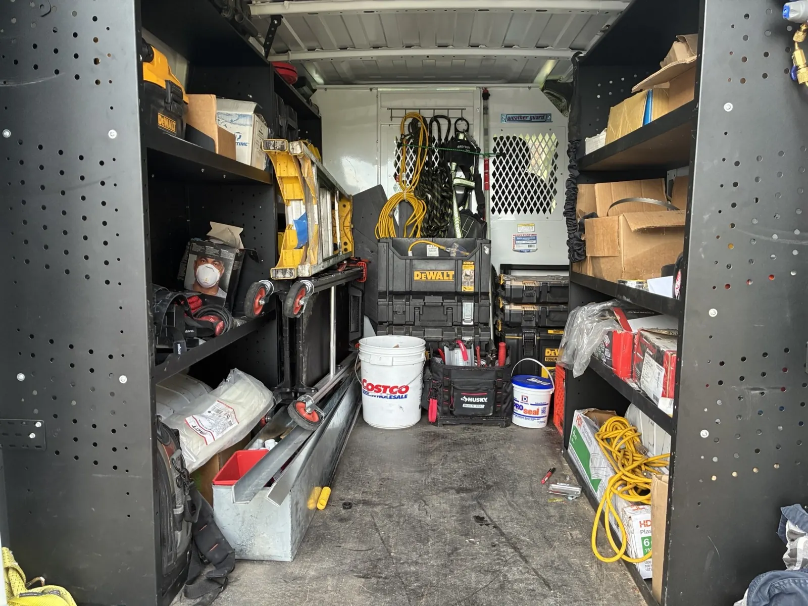Organized parts and tool shelving inside an Omni Mechanical service van