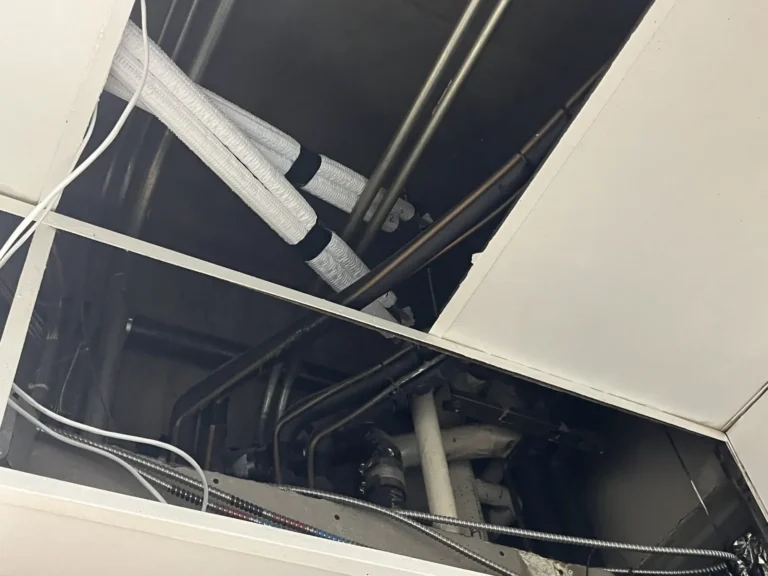 Insulated VRF refrigerant piping and branch joints above the ceiling grid