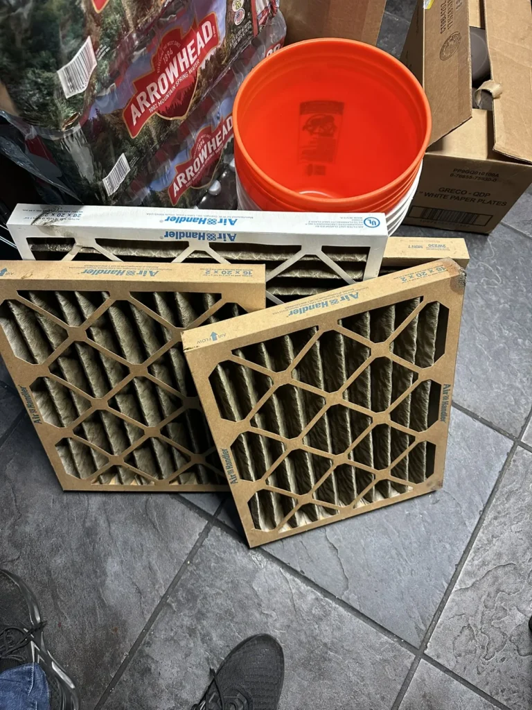 Dirty pleated air filters pulled during a filter change