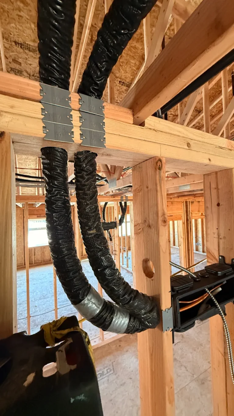 Insulated VRF refrigerant piping run through framing at a church renovation in Puyallup